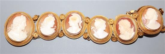 A Victorian yellow metal and cameo bracelet, set with seven oval cameos carved with various busts.